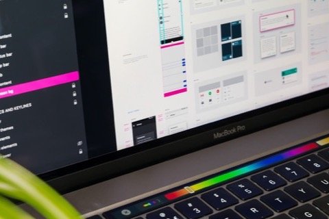 Website design mockups open on a laptop