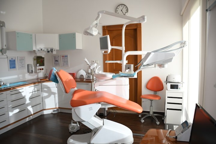 Dentist with a patient in a dental chair