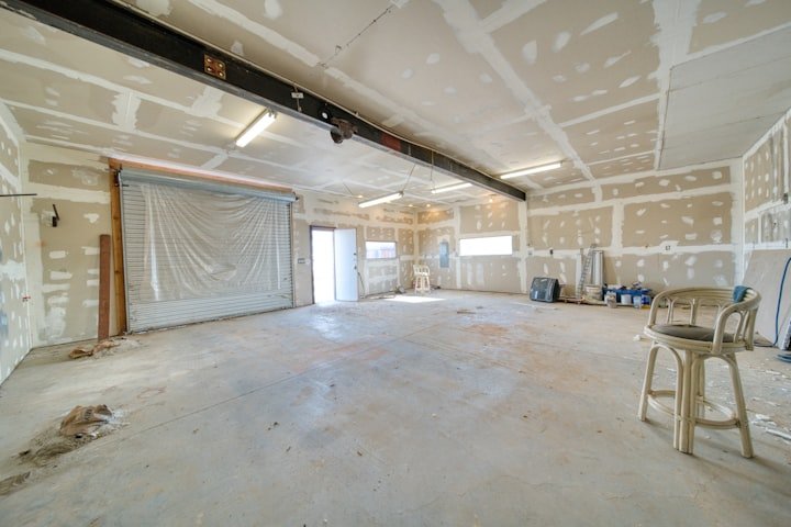 Worker installing drywall panels