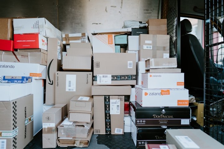Small business owner packing an online order