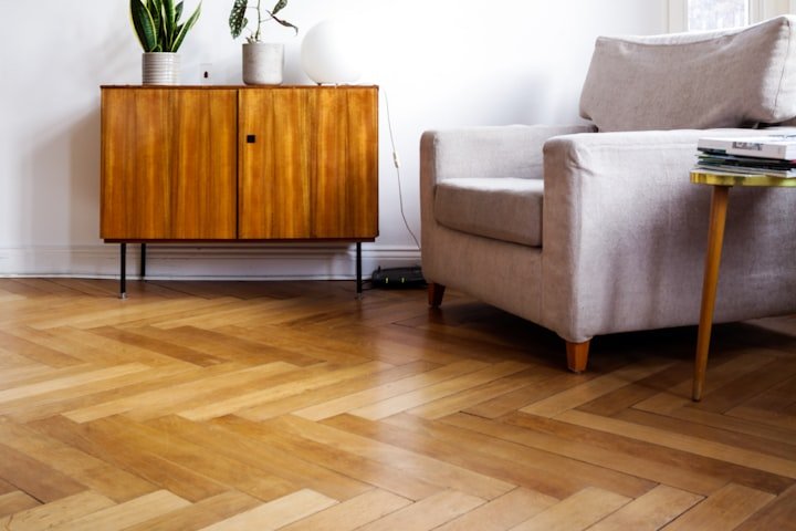 Flooring installer laying hardwood boards