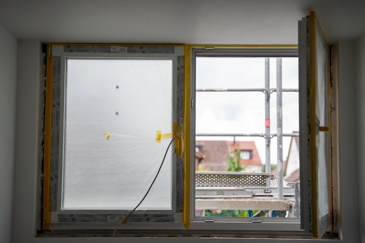 Worker installing a residential window